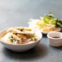 Chicken Pho · Savory Vietnamese style chicken broth ladled over rice noodles and sliced chicken breast, se...