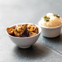 Eggplant Clay Pot · Asian eggplant braised in shallot soy sauce, with onion, garlic and black pepper, served wit...