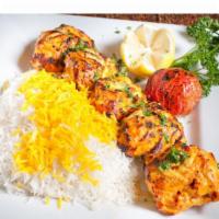 Chicken Shish Kabob · Tender chunks of marinated chicken filet in between a medley of onions, green peppers and to...