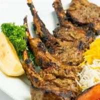 Rack of Lamb · Herb-marinated tender rack of lamb grilled over an open fire.