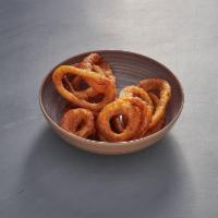 Onion Rings · Delicious crispy onion rings, comes with Ranch Sauce.