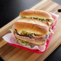 Ham, Turkey and Roast Beef Specialty Sub · Comes with provolone cheese, lettuce, tomato, onions, mayo, mustard, oil, and vinegar