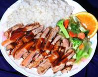 Chicken Teriyaki Plate · Boneless, skinless chicken marinated and grilled in our own special teriyaki sauce, served with Rice and house salad or steamed veggies.