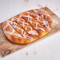 Cinnamon Stix · Oven baked bread stix, sprinkled with cinnamon sugar mix and vanilla icing.