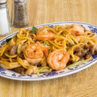 26. House Special Fried Noodle · Served with shrimp, beef and chicken.