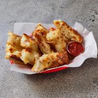 Cheese Bread · Includes pizza sauce. Extra dipping sauce for an additional charge.