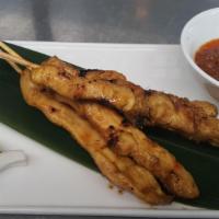 7. Satay Chicken (5 pieces) · Marinated grill chicken on the skewer. served with onion & cucumber and peanut sauce on the ...