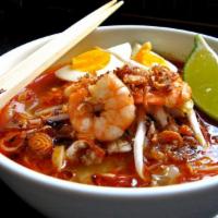 93. Prawn Mee 马来虾面 · Chef's spicy shrimp paste broth with yellow noodles and rice vermicelli noodle mix, shrimp, ...