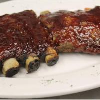 BBQ Ribs · Meaty St. Louis ribs basted with Sweet Baby Ray's sauce. Served with 2 sides.