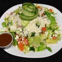 Greek Salad · Iceberg lettuce, tomato, red onion, olives and feta cheese. Served with your choice of dress...