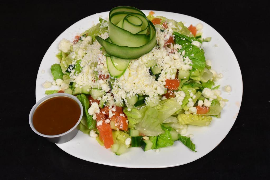 Greek Salad · Iceberg lettuce, tomato, red onion, olives and feta cheese. Served with your choice of dressing. Healthy option.