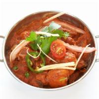 NV9. Lamb Vindaloo · Spicy hot dish of lamb cubes made with coconut, vinegar and red chilly peppers.
