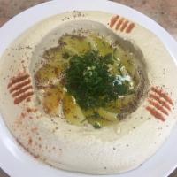 2. Hummus · A dip made with garbanzo beans, blended with garlic, lemon juice and tahini. Served with 1 p...