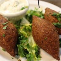 4. Kibbeh · 3 pieces. A mixture of ground meat and cracked wheat, stuffed with seasoned meat and onions,...