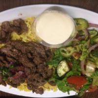 9. Beef Shawarma · Tender beef thinly sliced, seasoned and marinated with our authentic shawarma spices. Served...