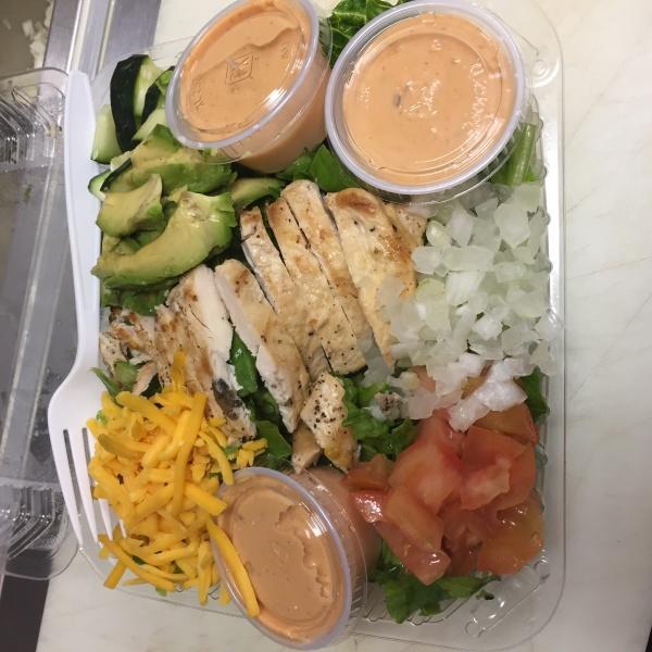 Chicken Avocado Salad · Grilled chicken, tomatoes, onions, cucumber, cheese and avocado over lettuce with choice of dressing. 