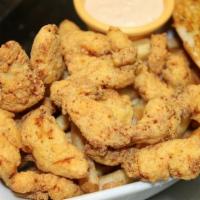 Alligator Bites · Alligator strips freshly breaded and fried. Served with fries and remoulade sauce.