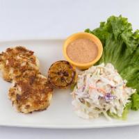 Crab Cake · 2 pan-seared jumbo limp crab cakes served with spicy remoulade sauce.
