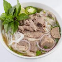 Beef Noodle Soup Lunch · Served with onion, green onions, cilantro, bean sprouts and basil.