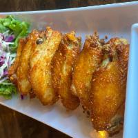 Lemongrass Chicken Wings Jr. (New) · Deep fried chicken wings marinated in lemongrass, black pepper. Served with a sweet and sour...