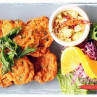 Tod Mun · Thai fish cake. Deep fried fish fillet blended with red chili paste and special Thai herbs. ...