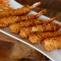Shrimp on the Beach · Shrimp coated in coconut flakes, fried and served with a sweet and sour sauce.