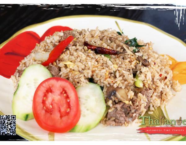Basil Fried Rice · Spicy fried rice with egg, mushrooms, onions, bell peppers. Served with cucumbers and crispy basil. Spicy.