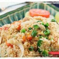Bangkok Fried Rice · Tradition Thai rice stir-fried with egg and vegetables, served with cucumbers and topped wit...