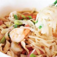 Tom Yum Noodle Soup · Rice noodle in tom yum soup with mushroom, tomato, onion, lemongrass and lime juice.
