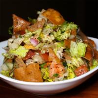 Fattoush Salad · Lettuce, cucumber, tomato, mint, pita chips and tangy sumac vinaigrette.