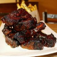 BBQ Ribs · Baby back ribs and house BBQ sauce.