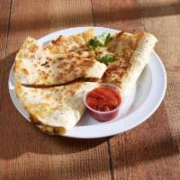 Quesadilla · Mozzarella and cheddar. Stuffed with green peppers, onions and jalapenos with salsa and sour...