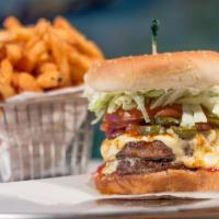 Mexican Burger · Topped with lettuce, tomato, mayo, grilled onions, jalapenos, hot sauce and white American c...