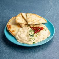 Hummus Appetizer · Chickpeas pureed with sesame oil, garlic, and lemon, drizzled with olive oil and garnished w...