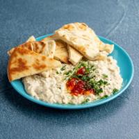 Baba Ghanoush · Smoked eggplant pureed with sesame oil, garlic, lemon and drizzled with olive oil.