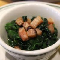 Wilted Spinach with Bacon · Spinach sauteed w/ EVOO, butter, & garlic