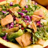Fattoush Salad · Mixed greens, onion, tomato, cucumber, pita chips and sumac with your choice of protein.