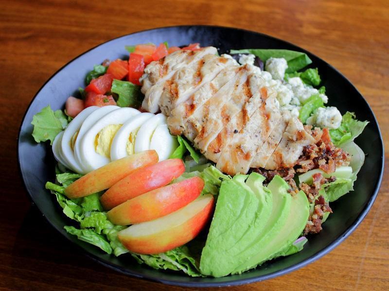 Northwest Cobb Salad · All-natural chicken breast, fresh greens, Gorgonzola cheese, bacon, egg, tomato, apple, and avocado. Served with blue cheese dressing.