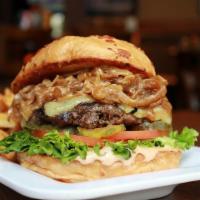 Blazing Onion Burger · Piled high with caramelized onions, tillamook white cheddar, lettuce, tomato, pickle, and BO...