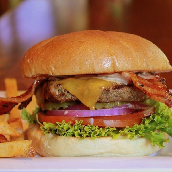 Bacon-Bacon-Bacon Cheeseburger · 3 pieces of extra thick peppered bacon, Tillamook cheddar, lettuce, onion, tomato, pickle, and BOB sauce on a kaiser roll. Served with choice of side.