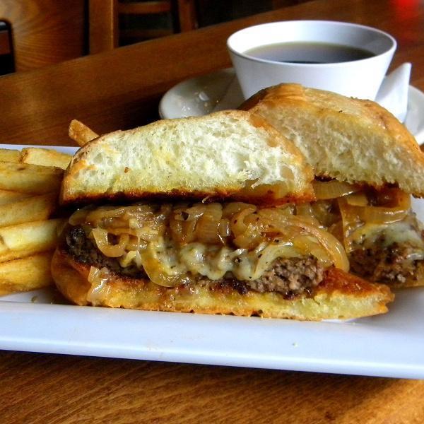Angus Burger Dip · Painted hills chuck patty, Swiss cheese, and caramelized onions on a garlic-buttered French roll. Served with au jus and choice of side.