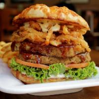 Mama's Meatloaf Burger · Old-fashioned, scratch-made meatloaf with tangy red glaze, crispy onion straws, lettuce, tom...