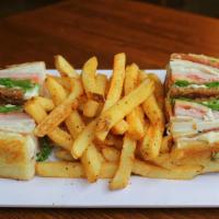 Avocado Club Sandwich · Slow roasted turkey, all-natural ham, thick peppered bacon, Swiss cheese, lettuce, tomato, a...