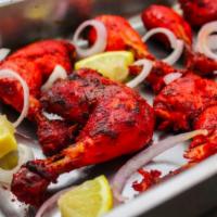 6. Half Chicken Tandoor · Quartered pieces of young succulent chicken marinated over night with special spices and her...
