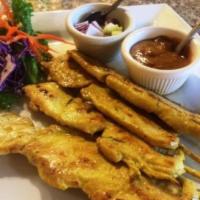 Satay · 4 pieces. Grilled marinated chicken tenders and peanut sauce. 