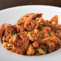 Jambalaya Linguine Fini  · Blackened chicken and shrimp, Andouille sausage and Tasso ham in our spicy Cajun sauce.