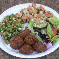 Falafel Platter with 2 Large Sides · The original falafell balls, lettuce, tomatoes, cucumber and tahineh rolled in pita bread.
