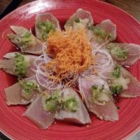 Albacore Tataki · Seared white tuna with ponzu sauce and fried onion on top.