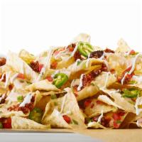 Ultimate Nachos · doubled layered / house-made tostada chips / chili / Hatch chile con queso / house-made pico...