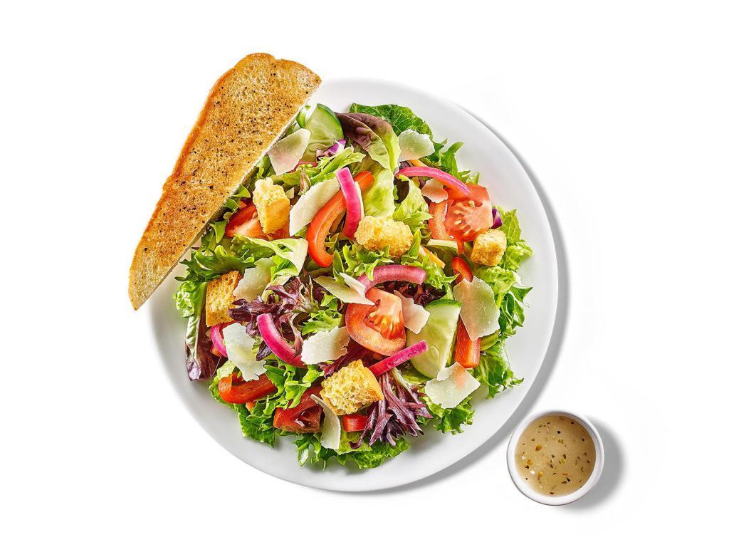 Garden Side Salad · Fresh greens with tomatoes, crunchy cucumbers, red peppers, house-pickled red onions, shaved Parmesan and croutons.  Served with a side of lemon vinaigrette and garlic toast.